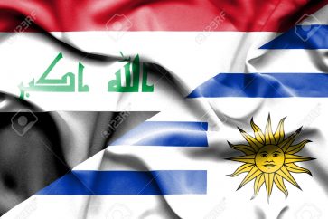Waving flag of Uruguay and Iraq