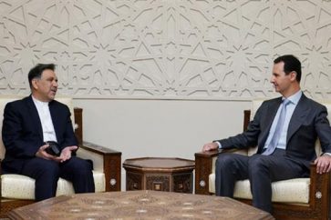 Bashar al Assad derecha) y Abbas Ajundi