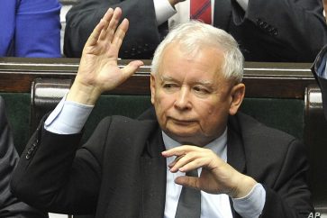 Leader of the ruling Law and Justice party, Jaroslaw Kaczynski votes to approve a law on court control, in the parliament in Warsaw, Poland, Thursday, July 20, 2017. The bill on the Supreme Court has drawn condemnation from the European Union and has led to street protests. (AP Photo/Alik Keplicz)