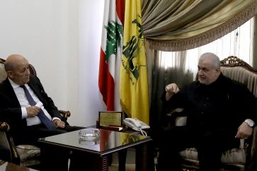 French special envoy Jean-Yves Le Drian (L) meets with Lebanon's Mohammed Raad, head of Hezbollah's parliamentary bloc, in Beirut's southern suburbs on September 24, 2024. (Photo by AFP)